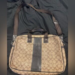 A signature coach leather laptop bag with strap pre-owned